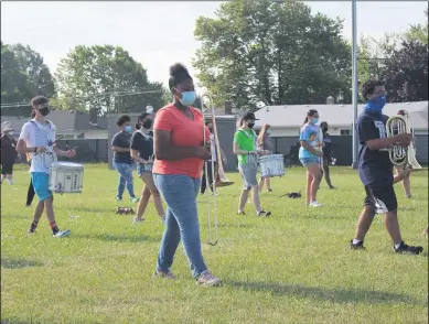  ?? LYRIC AQUINO — THE MORNING JOURNAL ?? Lorain High School’s marching band practices for the upcoming season.