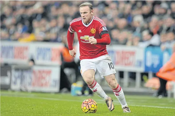  ??  ?? United striker Wayne Rooney runs with the ball during the Premier League match against Newcastle United.