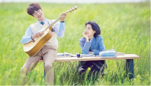  ?? The Sound of Magic. ?? Il Deung (Hwang) serenades Ah Yi (Choi) in a dreamy scene from the K-drama