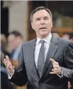  ?? ADRIAN WYLD THE CANADIAN PRESS ?? Finance Minister Bill Morneau says the new USMCA could be signed ahead of next week’s change in government in Mexico.