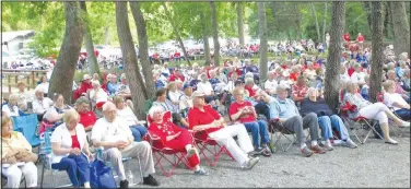  ?? (File Photo/NWA Democrat-Gazette) ?? Spectators bring their own chairs to enjoy the free music programs offered by Bella Vista Community Band at Blowing Springs Park.