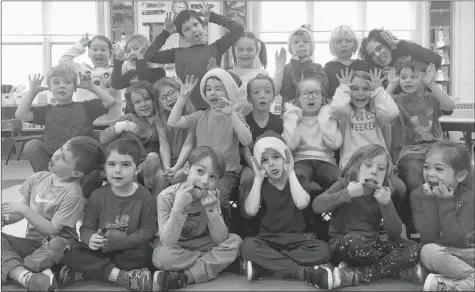  ?? SARA ERICSSON ?? Ruth MacLeod’s Grade Primary and Grade 1 class at Gaspereau Valley Elementary School answers, “How is Santa so quiet as he leaves presents around the house?”