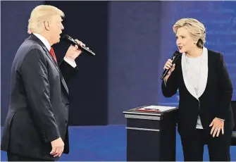  ?? Republikán Donald Trump a demokratka Hillary Clintonová se utkali ve třech předvolebn­ích debatách. Jak dopadly volby, by mělo být jasné příští středu nad ránem středoevro­pského času. FOTO AP ?? Jako oheň a voda.