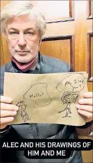  ?? ?? ‘COMIC’ RELIEF? Alec Baldwin holds up drawings of himself with wife Hilaria — with one showing him pleading, “Oh, God. Please help me. I’m dying” — in photos that Hilaria shared to her Instagram stories on Wednesday.