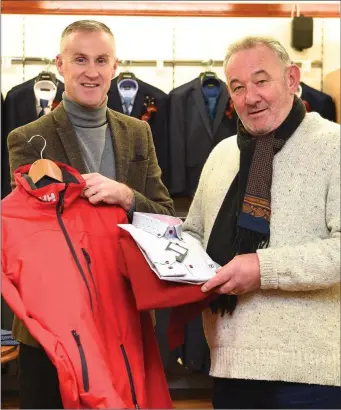  ??  ?? Thomas Croash (right) purchasing a Tricot Denim Jumper and Shirt with a Helly Hanson jacket from Sean Hussey at Quill’s, Kenmare.