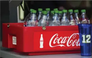  ?? RUTH FREMSON, NEW YORK TIMES ?? Coca-Cola has increased dividends in each of the last 50 years. Most companies aren’t so consistent.