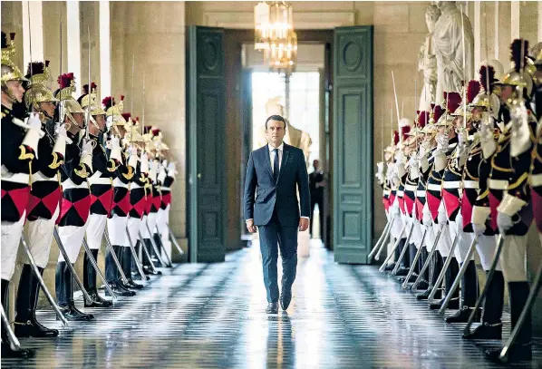  ??  ?? Emmanuel Macron makes his way through the Palace of Versailles before addressing both houses of the French parliament in a state of the union-style speech, a gathering for which the president was criticised