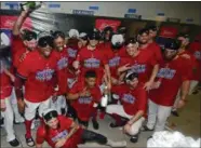  ?? DAVID DERMER — THE ASSOCIATED PRESS ?? Indians players celebrate in the clubhouse after defeating Tigers, 15-0, to clinch the American League Central Division on Sept. 15 at Progressiv­e Field.