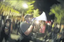  ?? MARCIO JOSE SANCHEZ — THE ASSOCIATED PRESS ?? A speaker addresses the crowd during a Black Lives Matter protest at the Mark O. Hatfield United States Courthouse Thursday, July 30, 2020, in Portland, Ore.