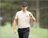  ?? Kevin C. Cox / Getty Images ?? Justin Rose reacts to his putt on the third green during the third round of the Masters at Augusta National Golf Club on Saturday.