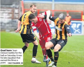  ?? 130217SALB­ION_09 ?? Goal hero Sean Dickson battles for the ball on Saturday. It was his late equaliser that earned the Binos a point