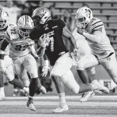  ?? ?? Rice running back Jordan Myers, center, leads the Owls with 264 yards. As a team, Rice ranks 82nd nationally with 147.3 yards per game.