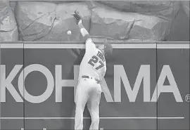  ?? Sean M. Haffey Getty Images ?? MIKE TROUT HAS MADE some highlight-reel catches, but he can’t rob Philadelph­ia’s Nick Williams of a two-run homer in the second inning.