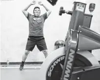  ?? Elizabeth Conley / Staff photograph­er ?? Joel Preses warms up in a smaller gym inside 24 Hour Fitness in the Heights earlier last month. The CDC has since said it was safe to gather indoors with other vaccinated people.