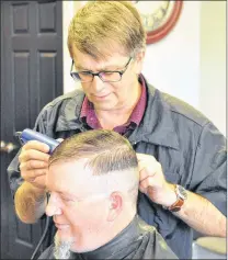  ?? KENN OLIVER/THE TELEGRAM ?? Barry Cutler works on customer Chris Meadus Friday morning at Straight Edge Barbers at Ropewalk Plaza in St. John’s.