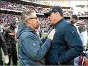  ?? JASON MILLER / GETTY IMAGES ?? Carolina Panthers coach Ron Rivera (right) congratula­tes Cleveland Browns interim head coach Gregg Williams following Sunday’s game.