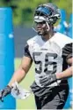  ?? JOHN RAOUX/AP ?? Dante Fowler walks across the practice field Monday. He tore his ACL last year.