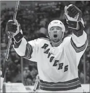  ?? ED BETZ/AP PHOTO ?? The New York Rangers’ Chris Simon celebrates a goal against the New York Islanders on Feb. 26, 2004, at Nassau Coliseum in Uniondale, N.Y.