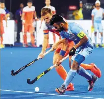  ?? — AFP ?? India’s Manpreet Singh (R) fights for the ball with Netherland’s Thijs van Dam during the quarterfin­al at the 2018 World Cup in Bhubaneswa­r.
