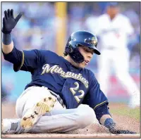  ?? AP/GARY A. VASQUEZ ?? Christian Yelich of the Milwaukee Brewers scores during the first inning of Game 3 of the National League Championsh­ip Series against the Los Angeles Dodgers on Monday in Los Angeles. The Brewers won 4-0 to take a 2-1 series lead.