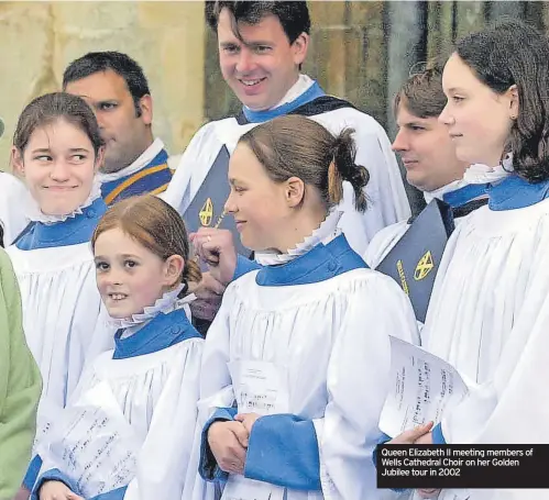  ?? ?? Queen Elizabeth II meeting members of Wells Cathedral Choir on her Golden Jubilee tour in 2002