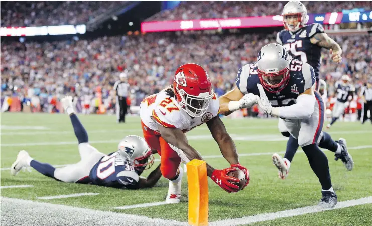  ?? — GETTY IMAGES ?? Kansas City Chiefs rookie Kareem Hunt scored three touchdowns and had 239 total yards as the visitors shocked the champion New England Patriots, Thursday.