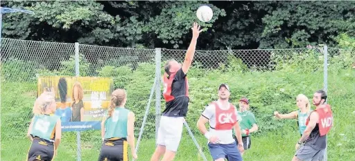  ??  ?? Players in action during the Hilary Floyd-Ellis Netball Cup at Bridgend Tennis Club. Pictured is tennis coach Stephen Richards in defence