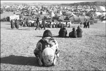  ?? JAMES MACPHERSON/THE ASSOCIATED PRESS ?? Protesters gather at an encampment Saturday, a day after tribal leaders received a letter from the U.S. Army Corps of Engineers that told them the federal land would be closed to the public on Dec. 5, near Cannon Ball, N.D.