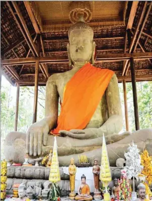  ?? PUTHPISETH TUN ?? A statue of a 13th-century seated Buddha at Tep Pranam, a terrace in Angkor Thom.