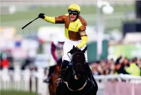  ?? (Getty) ?? Pau l Townend wins the Go l d Cup on Ga l opin Des Champs at Che l tenham yesterday