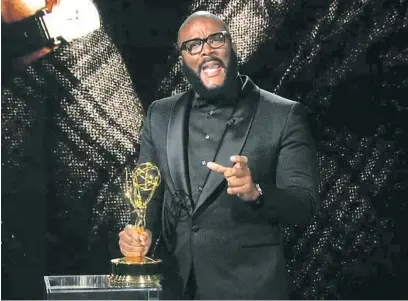  ?? ABC ?? TYLER PERRY accepts the Governors Award from the Television Academy for his prolific contributi­ons to the medium.