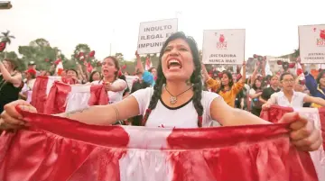  ??  ?? People protest against Fujimori’s pardon in Lima, Peru. — Reuters photo