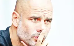  ??  ?? Manchester City’s record-breaking previous season was crowned with their first league title under the management of Pep Guardiola, pictured in May 2018, who is warning fans not to expect a repeat in the upcoming season. - AFP photo