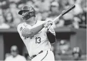  ?? JAY BIGGERSTAF­F USA TODAY Sports ?? Kansas City Royals catcher Salvador Perez hits an RBI single during Wednesday night’s game against the Toronto Blue Jays at Kauffman Stadium.