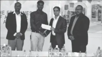  ??  ?? Mark Alleyne (second from left) is seen receiving the sponsorshi­p from Zulfikar Ali of the New GPC’s. GFF President Wayne Forde is at left and Petra Director Troy Mendonca, right.