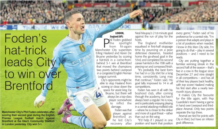  ?? AP ?? Manchester City’s Phil Foden celebrates after scoring their second goal during the English Premier League football match against Brentford at the Gtech Community Stadium in London yesterday. City won 3-1.