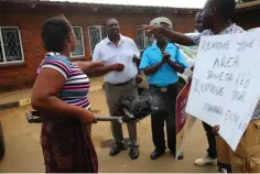  ?? ?? Budiriro 1 residents confront Harare City Council officials at their offices in the suburb yesterday protesting against their failure to remove a dump site polluting the residentia­l area with smoke from uncollecte­d garbage which has been burning for days. Picture: Joseph Manditswar­a