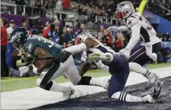  ??  ?? In this Feb. 4 file photo, Philadelph­ia Eagles’ Corey Clement catches a touchdown pass during the second half of the NFL Super Bowl 52 football game against the New England Patriots in Minneapoli­s. The play was reviewed and called a touchdown. The...