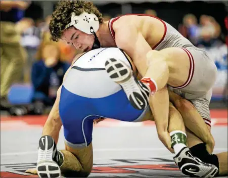  ?? NATE HECKENBERG­ER - FOR DIGITAL FIRST MEDIA ?? Owen J. Roberts’ Dan Mancini tries to finish a takedown in an overtime win over Hempfield’s Luke Kemerer at 152 pounds.