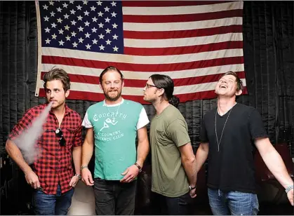  ??  ?? This Sept. 5 photo shows members of Kings of Leon, from left, Jared Followill, Caleb Followill, Nathan Followill and Matthew Followill posing in Nashville, Tenn. The band’s latest album, “Mechanical Bull,” was released Tuesday.