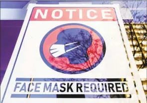  ?? Matt Rourke Associated Press ?? MASKING is effective in preventing disease transmissi­on. Would you opt for surgery in an operating room full of bare-faced doctors and nurses?