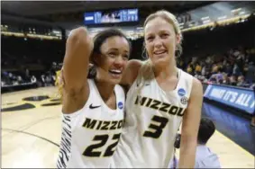  ?? CHARLIE NEIBERGALL - THE ASSOCIATED PRESS ?? Missouri guard Jordan Roundtree, left, walks off the court with teammate Sophie Cunningham after a first round women’s college basketball game against Drake in the NCAA Tournament, Friday, March 22, 2019, in Iowa City, Iowa.