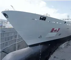  ?? THE CANADIAN PRESS FILES ?? The Resolve-Class naval support ship Asterix is unveiled at a ceremony at the Davie shipyard in Levis, Que., on July 20. Royal Canadian Navy sailors will begin training on the new ship in early January.