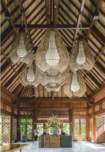  ??  ?? Right: The lobby at Andaz Bali. Below, from left: A guest room; one of the resort’s pool villas. Opposite, from top: Lush surrounds lend the new property an establishe­d feel; a grilled seafood platter at the Fisherman’s Club. LIGHTING THE WAY