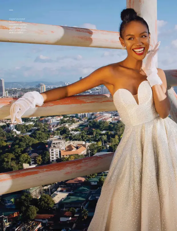  ??  ?? Crystal encrusted ballgown with sweetheart neckline, GLENN CANLAS; sheer bridal gloves, RON RAMIRO.