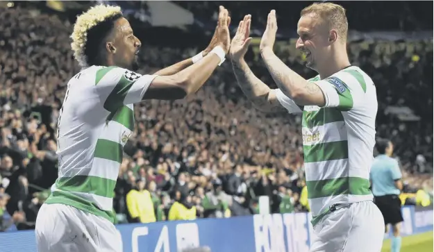  ??  ?? 0 Celtic’s two-goal hero Scott Sinclair, left, and Leigh Griffiths during the 5-0 defeat of FC Astana at Celtic Park which put the Champions League group stage within reach.