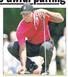  ?? AP ?? SHORT GAME TO BLAME: Tiger Woods lines up a putt on a day he struggled mightily on the greens, leading to an even-par 71 in the first round of the Wells Fargo Championsh­ip on Thursday.
