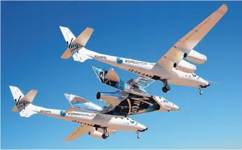  ?? COURTESY VIRGIN GALACTIC ?? Virgin Mothership Eve carries Virgin Galactic spaceship Unity for its first flight ever over Mojave, Calif., in 2016.