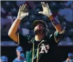  ?? SUE OGROCKI — THE ASSOCIATED PRESS ?? The Athletics’ Francisco Pena gestures as he crosses the plate after his home run in the sixth inning of Monday’s game.