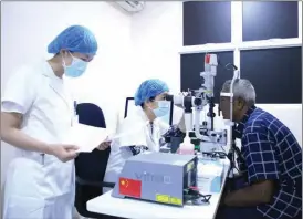  ?? CHE HONGLIANG / XINHUA ?? Chinese experts from the China-Maldives Ophthalmol­ogy Centre conduct an eye examinatio­n on a patient at Hulhumale Hospital in Male, Maldives, on Feb 4. The launch ceremony of the China-Maldives Ophthalmol­ogy Assistance and Cooperatio­n project was held at the hospital on Feb 11. China will assist the Maldives in building an eye center and send medical experts to train local medical staff so that they can carry out routine eye operations, while Maldivian medical workers will also be sent to China for further study.